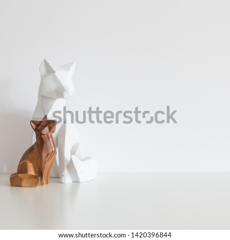Two wooden foxes. Modern home decor.