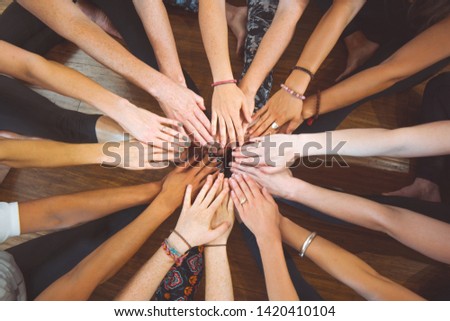 Hands working together as a team Royalty-Free Stock Photo #1420410104