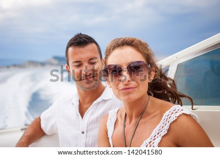 picture of happy young couple on their yacht