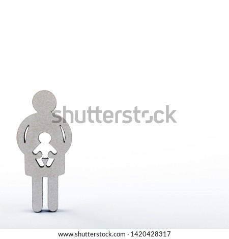 Mother and child. Wooden figures isolated on white background. Pregnancy, abortion or adoption concept.