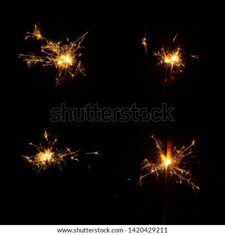Decorative sparklers on black background