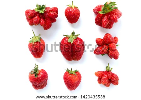 Ugly strawberries on white background. Royalty-Free Stock Photo #1420435538