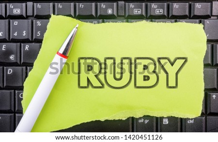 Ruby programming language. Paper width word Ruby and pencil on laptop keyboard
