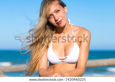 Pretty blonde girl at the beach