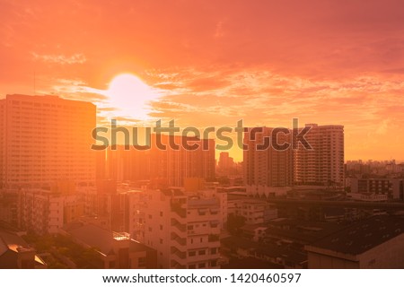 Golden light sunset or sunrise in summer Bangkok city Thailand, Hot weather image Royalty-Free Stock Photo #1420460597