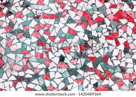 Closeup of trendy coloured red, grey, white and dark green abstract mosaic ceramic tiles patterned background