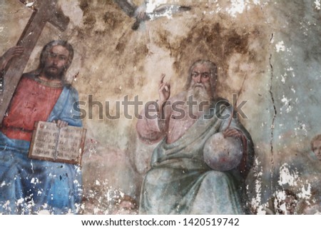 Unique fresco Holy Trinity: Father, Son, Holy Spirit (dove), temple of Archangel Michael, 19th century. Concept — cultural heritage, rebirth, restoration, faith, Christianity. Travel to Russia. Royalty-Free Stock Photo #1420519742