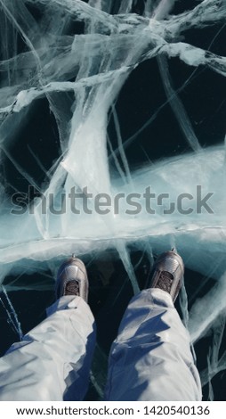 Ice skating on transparent Baikal ice