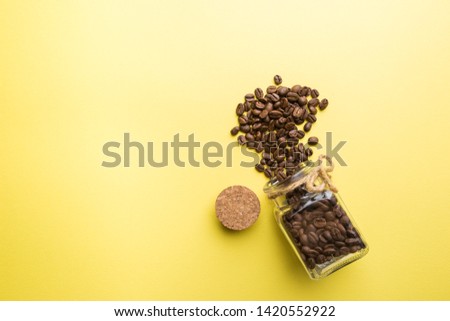 Coffee on a colorful yellow background. top view with copy space. morning concept.