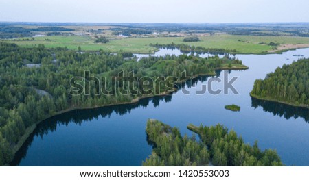 Blue lake. Fields and forest. The view from the heights. Tula.