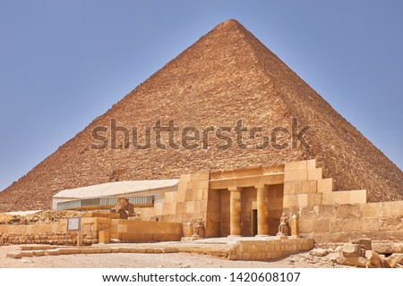 The Great Pyramid of Giza (Pyramid of Khufu or Pyramid of Cheops) is the oldest and largest of the three pyramids in the Giza pyramid complex, the oldest of the Seven Wonders of the Ancient World Royalty-Free Stock Photo #1420608107