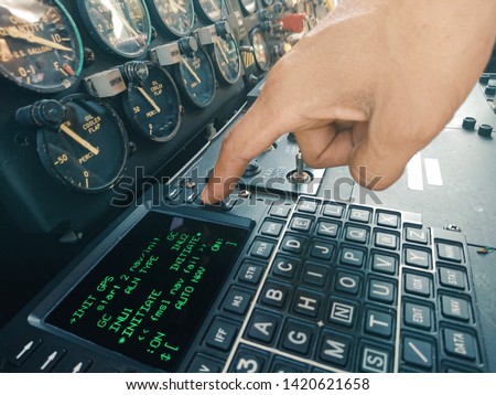 Hand of aircraft mechanic press the push bottom for operation check the system. Royalty-Free Stock Photo #1420621658