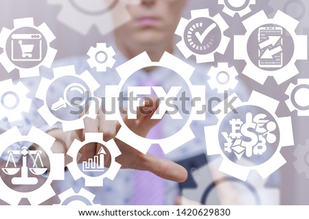 FX Foreign Exchange Market Financial concept. Businessman uses on a virtual screen of the future and touches the acronym: FX. Royalty-Free Stock Photo #1420629830