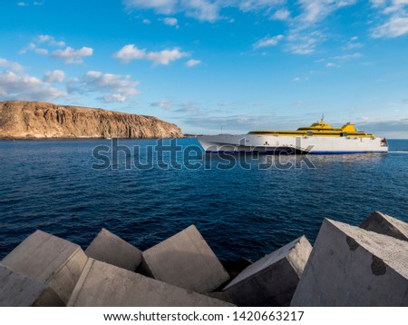 Fast ferry ship. Sunny summer day on Tenerife iceland. Royalty-Free Stock Photo #1420663217