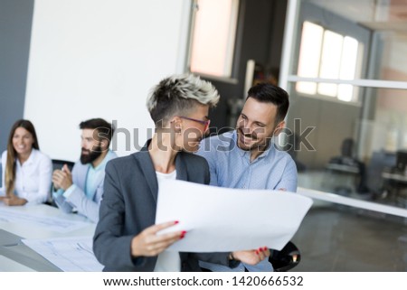 Picture of business colleagues talking in office