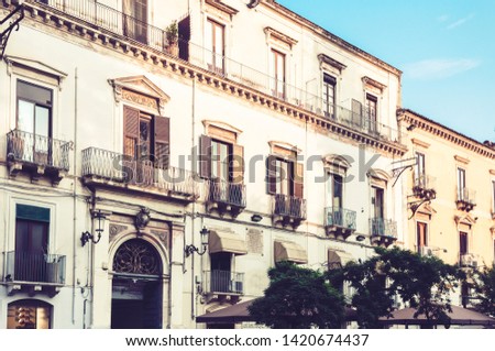 Italy, beautiful cityscape of Sicily, historical street of Catania, facade of old buildings 