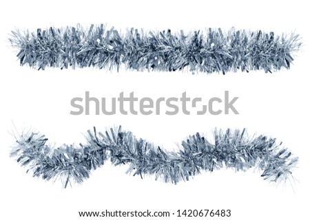 Two Christmas tinsel silver color for decoration. White isolate Royalty-Free Stock Photo #1420676483