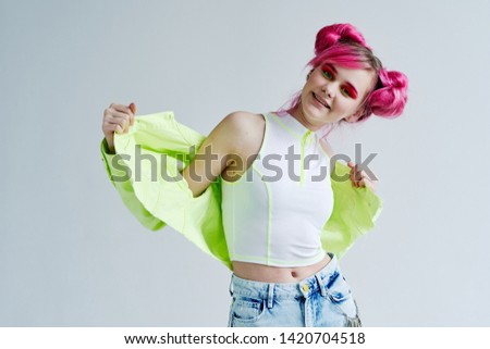 woman with pink hair in jeans