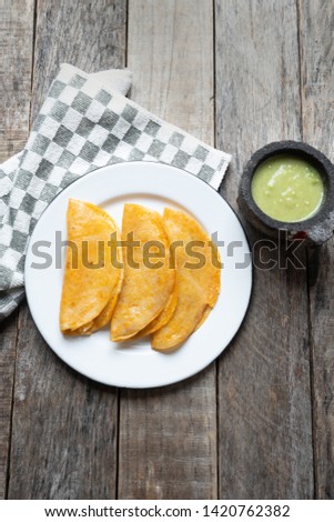Mexican food: authentic and tasty basket tacos "canasta" on colorful background