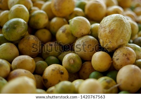 Bunch of Yellow lemon for sale at fruit market