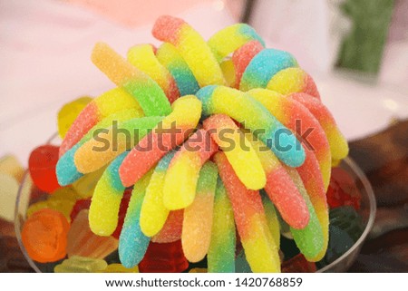 Rubber candies and rubber snakes of various types in green, red, blue and more