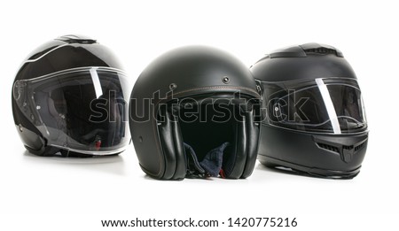 Three black motorcyle helmets isolated on white backgorund.