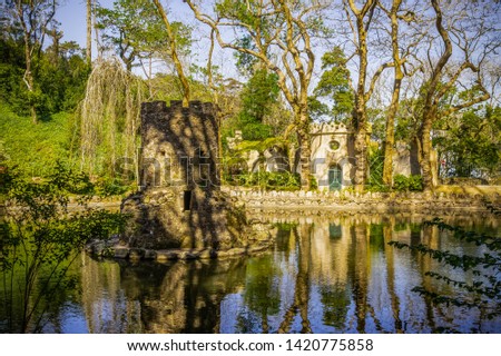 Tower in the pond. Park of the Palacio Nacional de Pena, Sintra, Portugal
