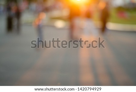 Sunny evening walk around the city. Blurred background.