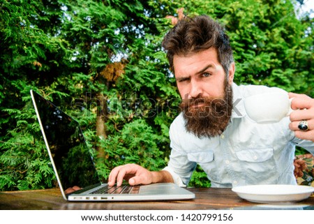 Caffeine booster for productivity. Online blog. Blogger freelance editor. Workaholic stereotype. Drink coffee work faster. Bearded man freelance worker. Remote job. Freelance professional occupation.