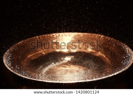 clear water in a golden bowl / clear water in a yellow iron bowl