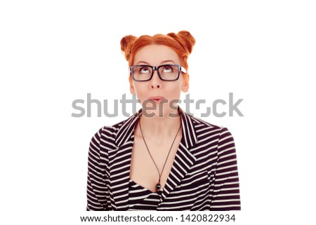 Wow. Closeup portrait young woman beautiful girl excited shocked looking up  wearing striped black white jacket with 2 buns up hairdo isolated on white background wall. Mixed race, Irish  Caucasian