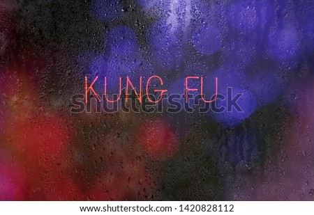Neon Kung Fu Sign in wet window