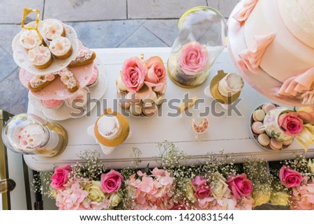elegant dessert table decoration with spring / summer theme flowers theme.