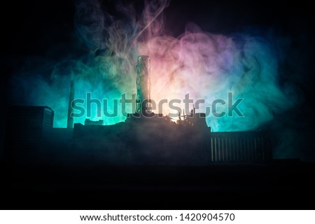 Creative artwork decoration. Chernobyl nuclear power plant at night. Layout of abandoned Chernobyl station after nuclear reactor explosion. Selective focus Royalty-Free Stock Photo #1420904570
