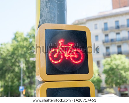 Close up of a red stop light for cyclists on a european cycle route in a city centre.