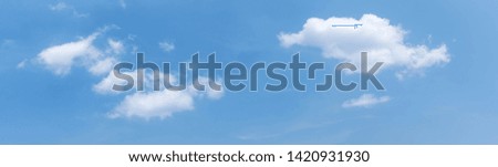 Beautiful Blue Sky Background with Tiny Clouds. Panorama Picture for Summer Season. Panoramic Banner Background.
