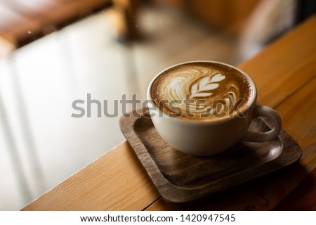 coffee latte on wood table  Royalty-Free Stock Photo #1420947545