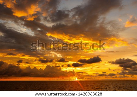 orange cloud formation during sunset