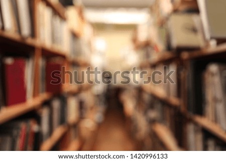 Blurred view of cabinets with books in library