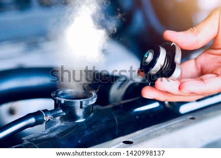 Car maintenance, car radiators help cool the engine Should see the appropriate water level, not to be dry or lacking. Royalty-Free Stock Photo #1420998137