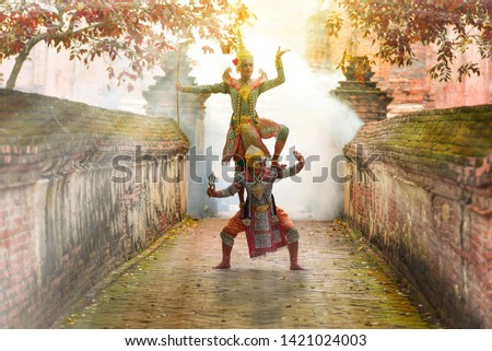 Khon is art culture Thailand Dancing in masked Ramakien and Hanuman are Dancing in literature Ramayana.
Khon is thailand culture and traditional sunlight background.