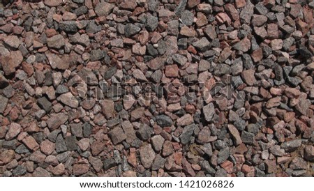 texture and background of gravel on the street in the summer
