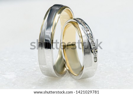Amazing Gold and Silver Wedding Rings on White Marble Background, Macro Close Up Photo, wedding photography