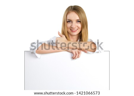 Beautiful business woman with blank billboard sign showing thumb up isolated over white background. Caucasian female model. attractive woman showing blank white placard. blonde holds empty poster