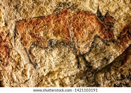 Cave picture of brown bison painted on the rock