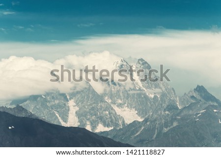 Beautiful landscape with majestic mountains, travelling view. Vintage stylization, retro film filter