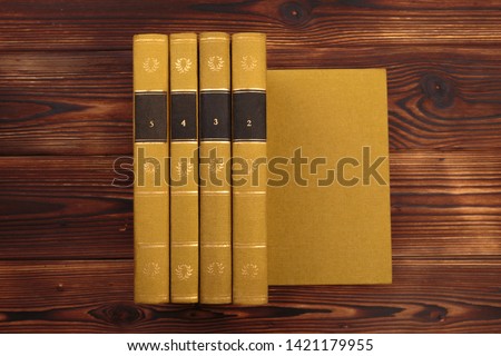 old books on the background of a wooden - Image 