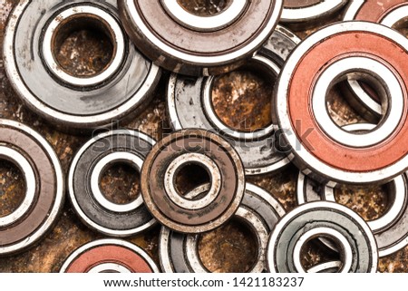 Various car parts and accessories, on metal  background bearings