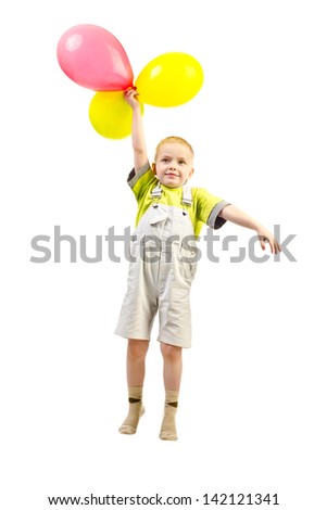 little boy flying with balloons
