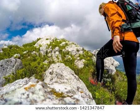 Young woman hiking on a cloudy day
